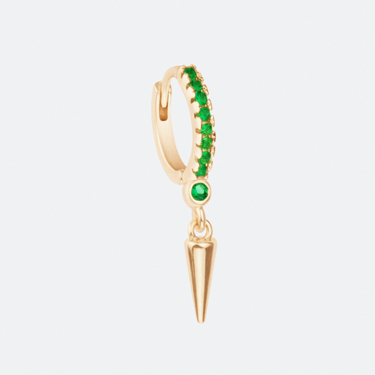 The emera hoop earring by Ocarina, an 18K gold-plated design featuring a row of vibrant green gemstones along the hoop and a bold dangling spike charm. A striking and edgy statement piece with a modern punk-inspired aesthetic, displayed against a clean white background.